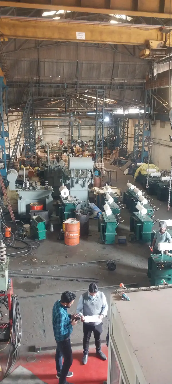 Dynamech engineers reviewing drawings on the transformer shop floor in Govindpura, Bhopal